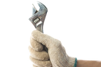 Workman holding spanner